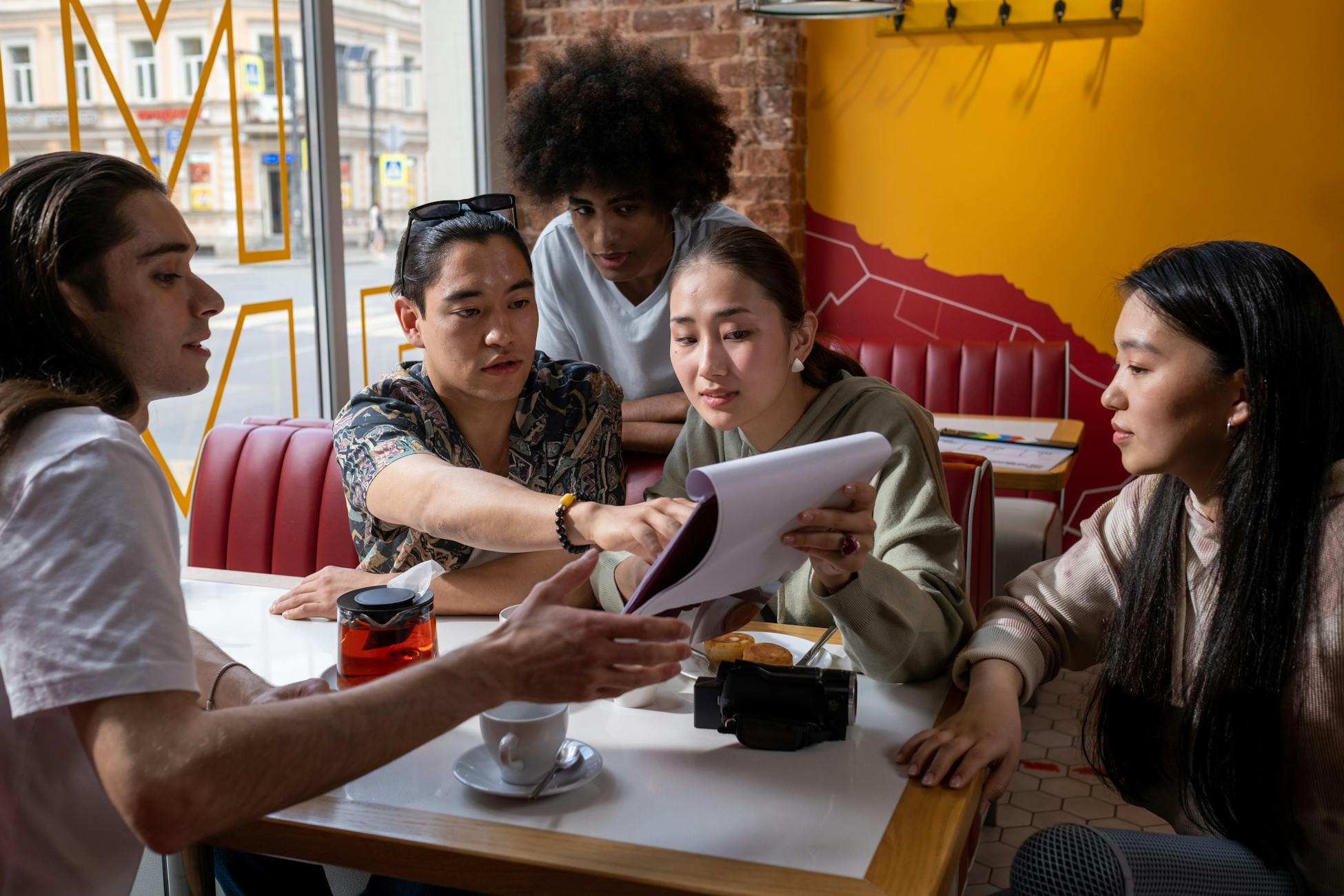 A multicultural group in conversation around a cafe table — the kind of community Civup helps you grow.